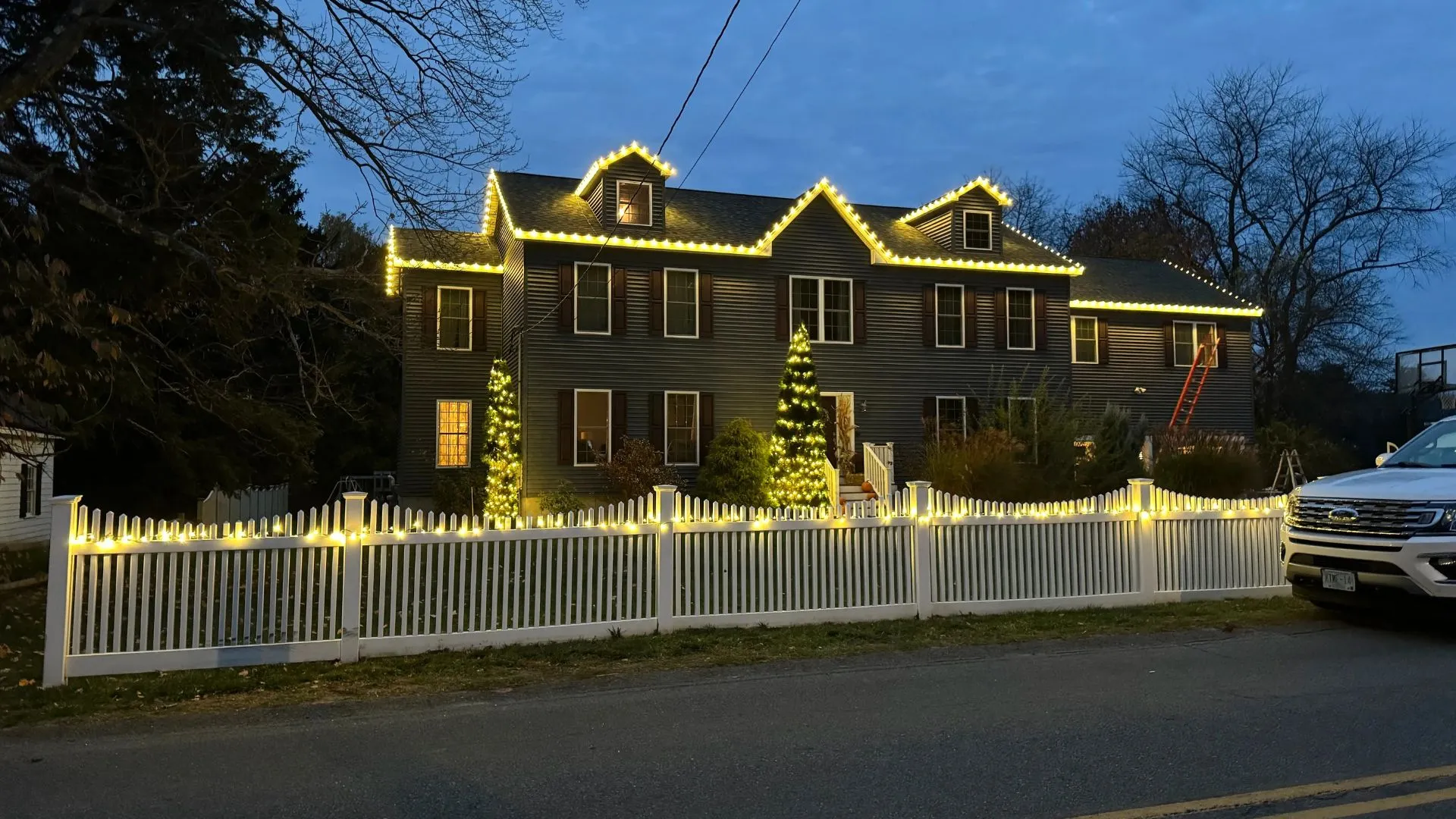 Historic New England brick facade with warm architectural accent lighting